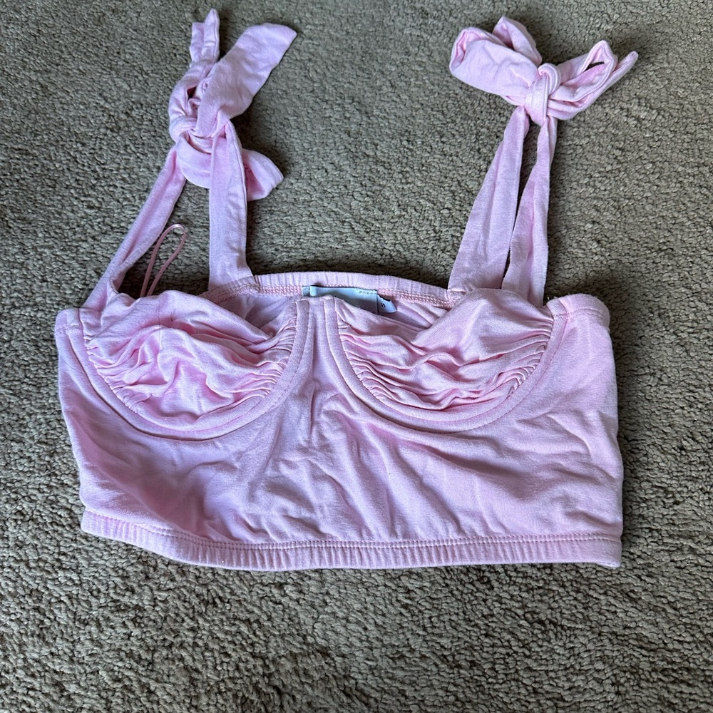 pink tank top tied on the shoulders